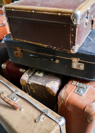 many old vintage travel bags, vertical photoの写真素材