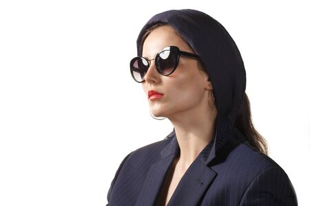 muslim fashionable woman in sunglasses, turban, blazer