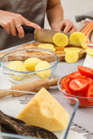 To cook, the salad, cut the potatoesの写真素材