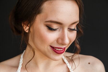 Beautiful girl in wedding dress posing in the bathroom, the interior