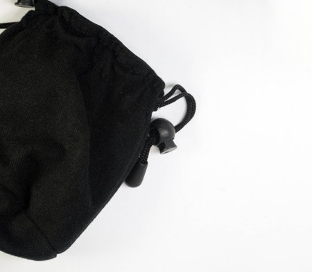 Black small pouch with knot and tie isolated in whiteの写真素材