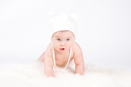 Baby with white capの写真素材