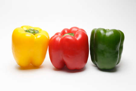 Red yellow green bell pepper isolated on white background.