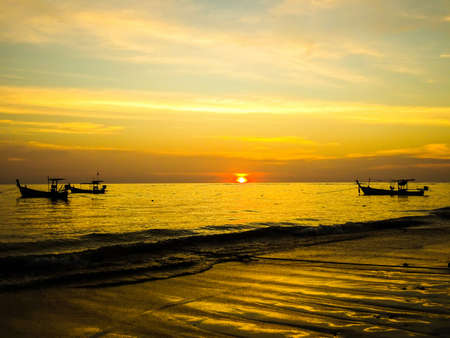 Sunset on the beach at Khao Lakの写真素材