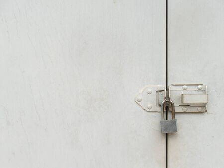 a mechanical device for securing a door or receptacle so that it cannot be opened except by a key or...
