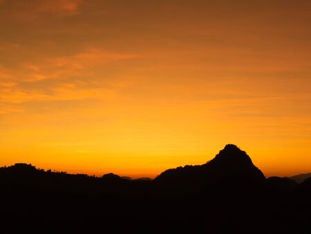Beautiful and peaceful scenery of sunset at the mountain range in the rural area.の写真素材