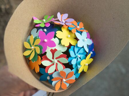Colorful paper craft flowers bouquet made from recycle paper.の写真素材
