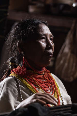 Mae Hong Son, Thailand - September 24, 2020 : Old lawa woman wearing traditional costume with beads...