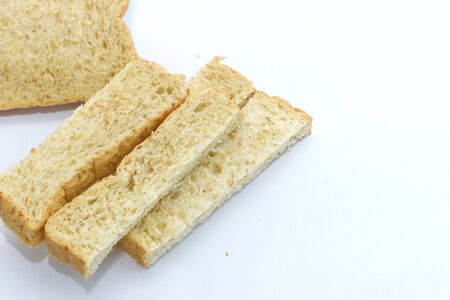 Slice of bread on white background. Breackfast food.の写真素材