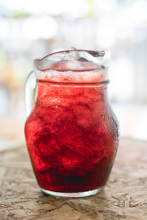 Glass pitcher with herbal juice,some blurred focusing : Roselle juice.の写真素材
