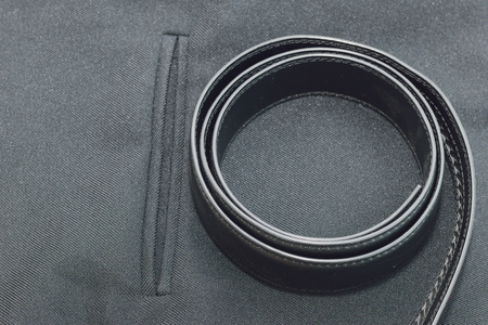 Black suit pocket and belt. Cloth for men.の写真素材