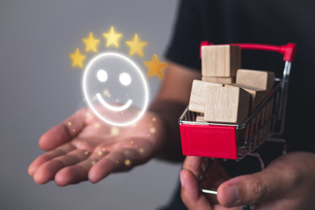 Evaluation and satisfaction concept. Five stars and smile emoji that shows an excellent supermarket. Close up shot on shopping cart.の写真素材
