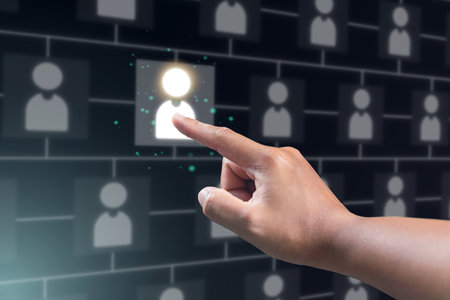 Recruitment concept. Human Resource Manager chooses new people to join an organization or support a cause. The man uses AI hologram to find a best person.の写真素材