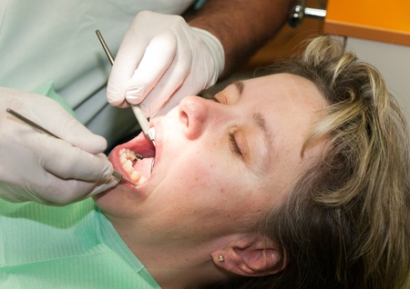 Woman in prophylaxis dental treatmentの写真素材