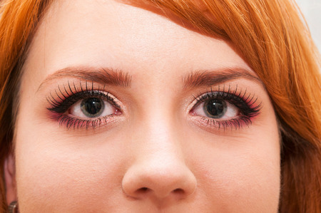 Young redhead girl with falsed eyelashの写真素材