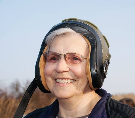 Smilling elderly lady in helmetの写真素材