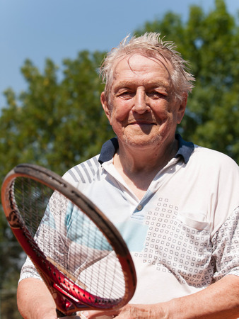 Portrait of 80 year old men after tennis matchの写真素材