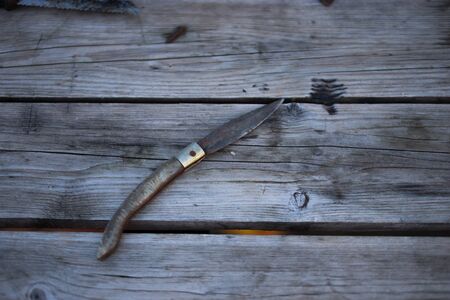 Close up of a Vintage Knife on a wooden backgroundの写真素材