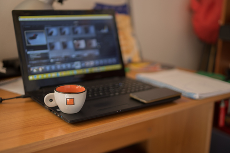 Coffee cup on a notebookの写真素材