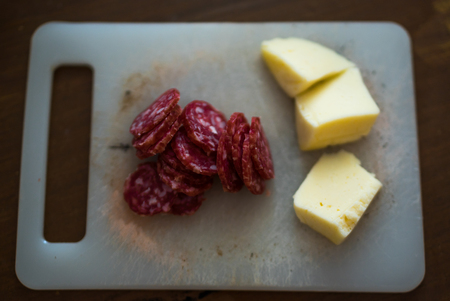closeup of salami slices and cheese
