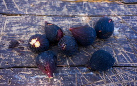 black figs on a wooden tableの写真素材