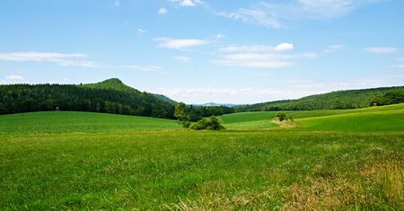 view over the fields and meadows to Gie huebel in Saxon Switzerlandの写真素材