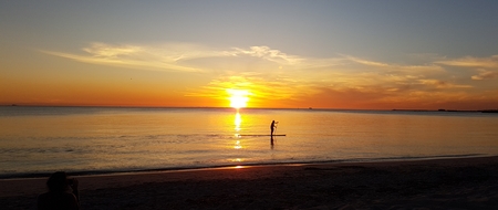 paddle boarder at sunsetの写真素材