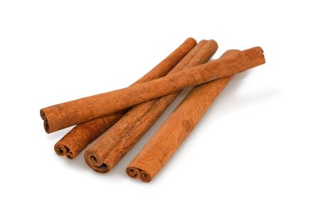 Cinnamon sticks isolated on whiteの写真素材