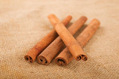 Cinnamon stick on jute backgroundの写真素材