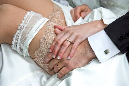 Married couple with rings and garterの写真素材