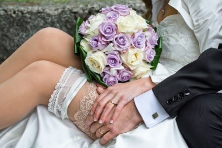 Married couple with rings, garter and bouquetの写真素材