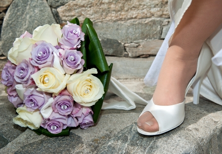 Bride shoes and wedding bouquetの写真素材