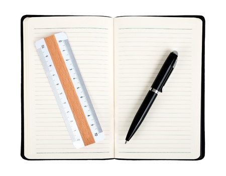Notebook with pen and ruler isolated on whiteの写真素材