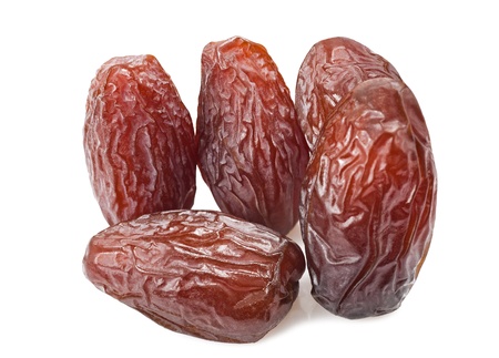 dried dates isolated on whiteの写真素材