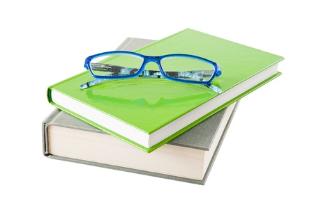Books and glasses isolated on white background の写真素材