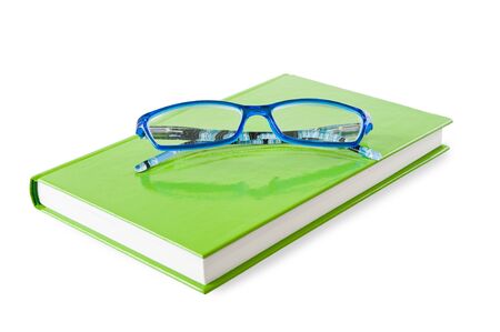 Book and glasses isolated on white backgroundの写真素材