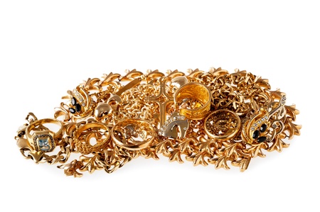 Mixed yellow gold jewelry on white backgroundの写真素材
