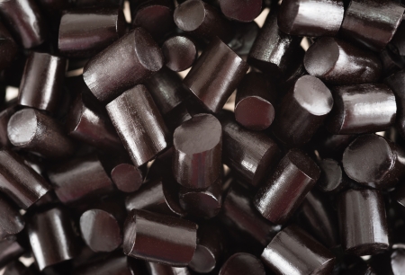 black pieces liquorice candy  backgroundの写真素材