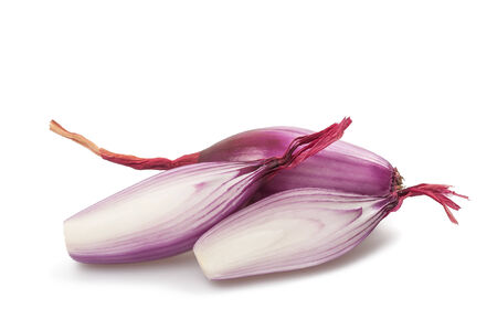 Red onions sliced isolated on whiteの写真素材