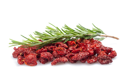 Dried tomatoes with rosemary isolated on white background の写真素材