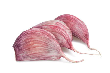 Garlic cloves isolated on white backgroundの写真素材