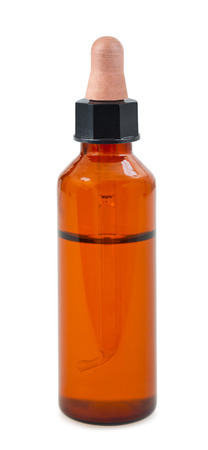 Herbal medicine or aromatherapy dropper bottle isolated on whiteの写真素材