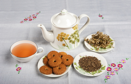 Cup of tea with cookies and tea potの写真素材