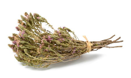 Dried thyme with flowers isolated on whiteの写真素材