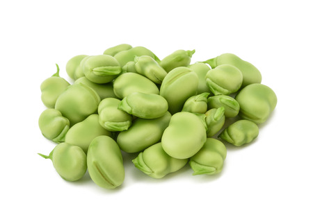 broad beans heap isolated on  white backgroundの写真素材
