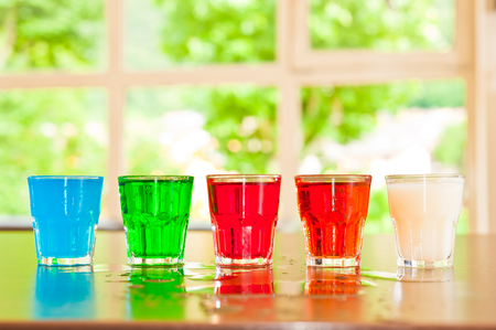  glass set with  colored cocktailsの写真素材