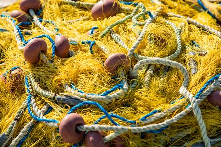 heap of fishing nets  with rope and floatings