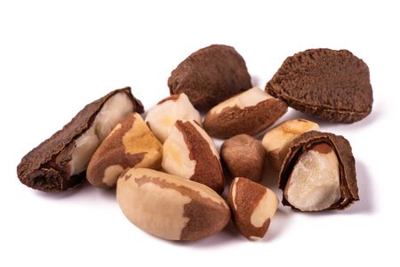 Brazil nuts group isolated on white backgroundの写真素材