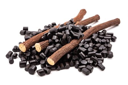 licorice candy and roots  isolated on white backgroundの写真素材