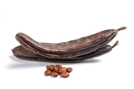 Carobs pods with beans isolated on white background